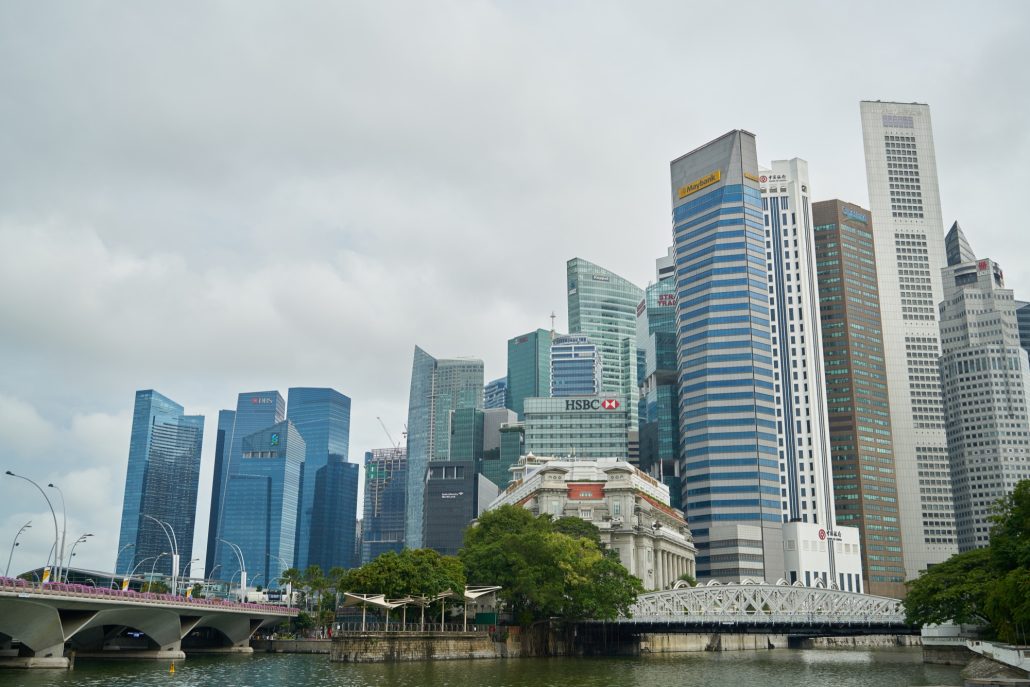 Aerial view of Singapore’s concrete jungle representing urban housing, with financial themes tied to ABSD and best home loan options
